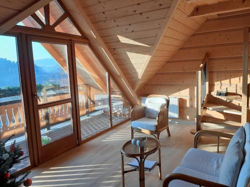 a living room with a view of a mountain at Villa of Roses in Lanckorona