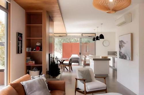 a living room with a couch and a table at Woodbridge Hill Country Escape in Woodbridge