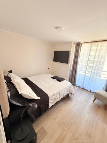 Una cama o camas en una habitación de Departamento con estacionamiento incluido, Ideal para ir de compras y conectar con puntos turísticos