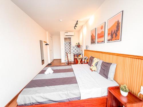 a bedroom with a large bed in a room at La Casa Di Dicembre 18 Hàng Cháo in Hanoi