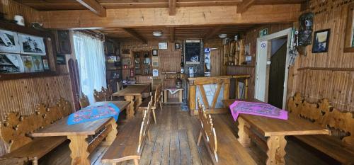 a room with wooden benches in a cabin at Chata Baców in Korbielów
