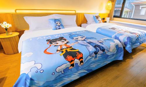 a bedroom with two beds with a painting on it at Lijiang Jinghua Inn in Lijiang