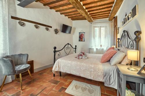 Postel nebo postele na pokoji v ubytování La casina in Via Fiorita