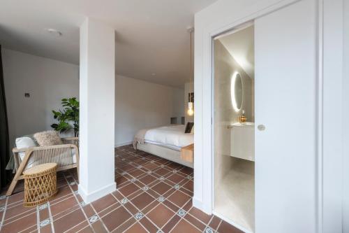 Ένα ή περισσότερα κρεβάτια σε δωμάτιο στο Hotel B&B Casa Arena Sevilla