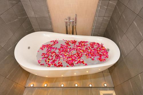 a bath tub filled with sprinkles in a bathroom at KNN Luxury Hill in Sen Monorom