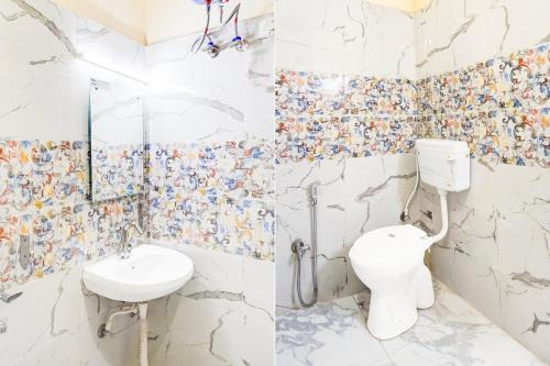 a bathroom with a toilet and a sink at Super Collection O Govind Vihar Matiyari Formerly Saffron in Lucknow