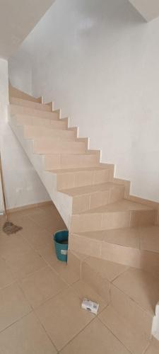 a staircase in a room with a blue bucket at Casa in Zacatecas