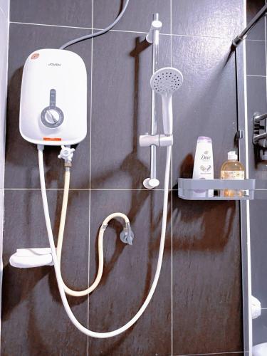 a shower in a bathroom with a hair dryer at Spacious Cozy Studio 1-3 Pax at D Secret Garden - Kempas-Setia Tropika-JB Centre-Mid Valley-Paradigm-UTM, Business Welcome in Johor Bahru