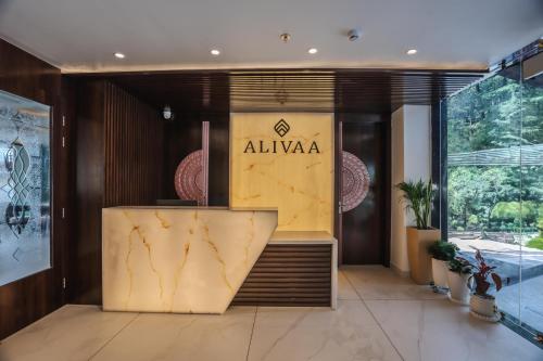 a lobby of an aliya store with a sign on the wall at Alivaa Hotel, McLeodganj With Best Dhauladhar View & Infinity Pool Sky Garden in McLeod Ganj