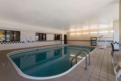 a swimming pool in a hotel room with a pool at Comfort Inn Wichita East in Wichita