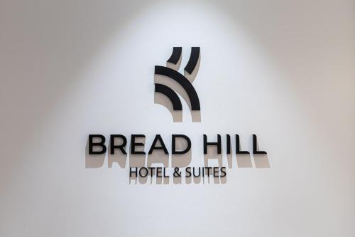 a logo for bread hill hotel and suites at Bread Hill Hotel Jongno in Seoul