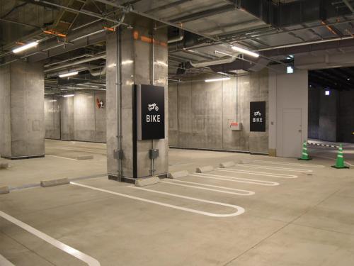 an empty parking lot with a bike sign in a building at SAPPORO HOTEL by GRANBELL in Sapporo