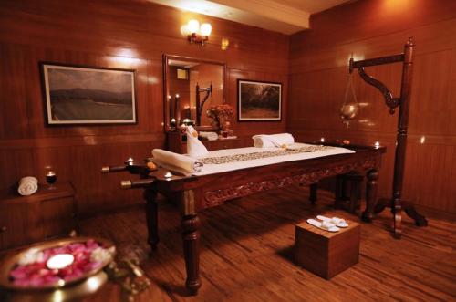 a bathroom with a large bed and a mirror at HOLYWATER Hotel by Ganga Kinare #150 mts from Ganga Ghat Rishikesh in Rishīkesh