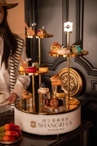 a display of cookies and pastries on a table at Shangri-La Nanning - The tallest hotel worldwide in Shangri-La Group in Nanning
