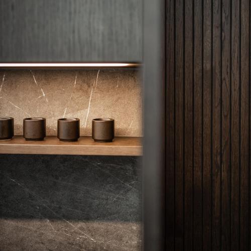 a row of coffee cups sitting on a shelf at La Sonett in Gmunden