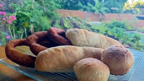 a plate of different types of pastries on a table at Fare Atihau Vairao in Matiti