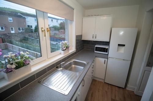 Η κουζίνα ή μικρή κουζίνα στο Modern 3 Bed Terrace