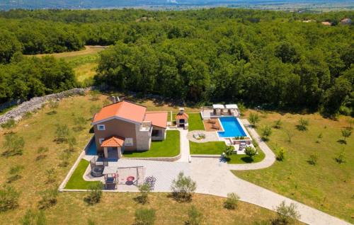 an aerial view of a house with a swimming pool at Villa Drazana - Makarska by Villas Guide in Perići