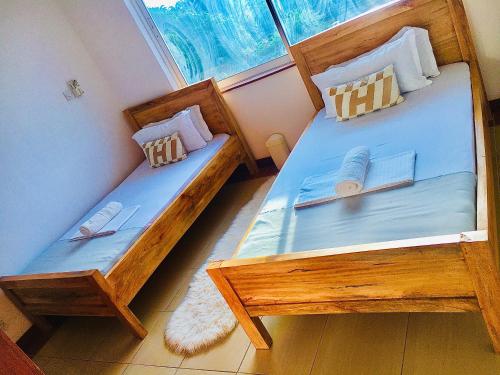 Ένα ή περισσότερα κρεβάτια σε δωμάτιο στο Wokabi Homes- Nyali 2BR Cosy Apartment