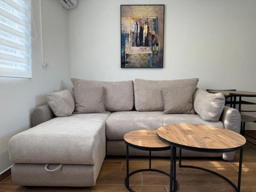 a living room with a couch and a table at Villagio in Virpazar