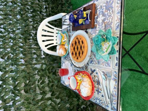 a plate with food on it on the ground at Il borgo di Iaconti in Vietri sul Mare