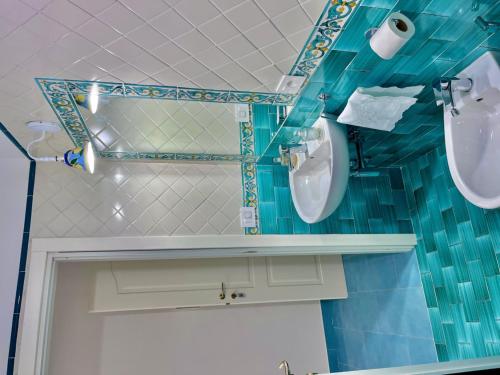 a bathroom with two toilets and a sink at Il borgo di Iaconti in Vietri sul Mare