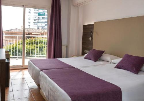 Postel nebo postele na pokoji v ubytování MedPlaya Hotel Alba Beach