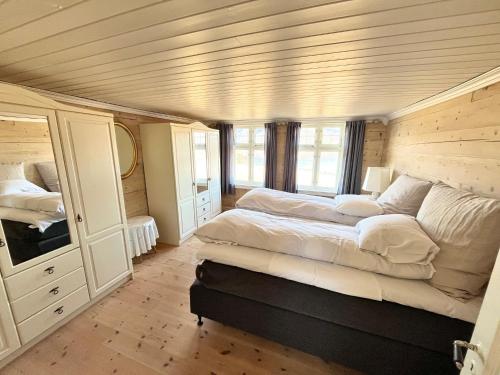 a large bedroom with a large bed in it at Oanes House in Strand