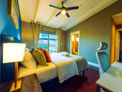 a bedroom with a bed and a ceiling fan at 2139 SanMateo 3B AC Home Parking WIFI fully Fenced Yard in San Mateo