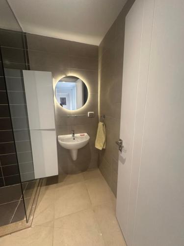a bathroom with a sink and a mirror at G Cribs Hotel Apartment 2BR in Hurghada