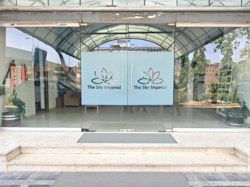 a sign in the window of a building at The Sky Comfort, Ahmedabad in Ahmedabad