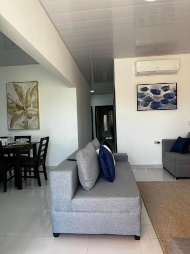 a living room with a couch and a table at Premium in Comayagua