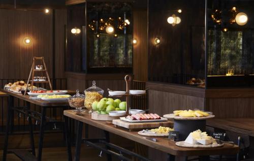 a buffet of food on tables in a restaurant at Hotel AKA Boston Common in Boston