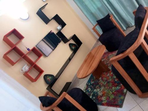 Televizorius ir (arba) pramogų centras apgyvendinimo įstaigoje NiceAp2stay