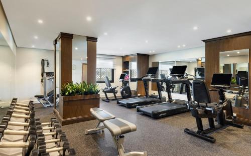 a gym with treadmills and exercise equipment in a room at The Oberoi Madina المدينة أوبروي in Al Madinah