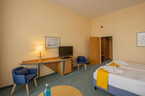 Ένα ή περισσότερα κρεβάτια σε δωμάτιο στο Seehotel Bollmannsruh