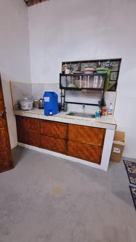 a kitchen with a sink and a counter top at Bahay Bakasyunan in Lubao near Pradera Verde in Lubao