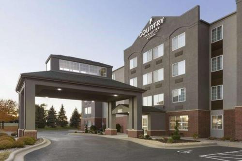 a hotel with a parking lot in front of it at Country Inn & Suites by Radisson, Eagan, MN in Eagan