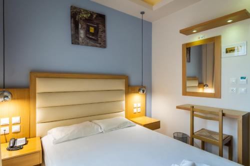 Postel nebo postele na pokoji v ubytování Pantheon Hotel