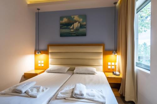 Postel nebo postele na pokoji v ubytování Pantheon Hotel