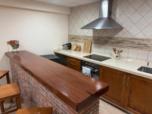 a kitchen with a counter top and a sink at Chalet los Jardines in Polanco