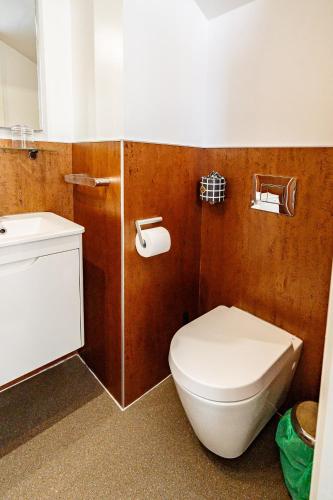 a bathroom with a toilet and a sink at The Lodge Harrogate in Harrogate