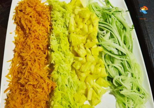 a plate of food with broccoli and other vegetables at Stylish 2-Beds beach side apart with common pool Post Lafayette in Roches Noires