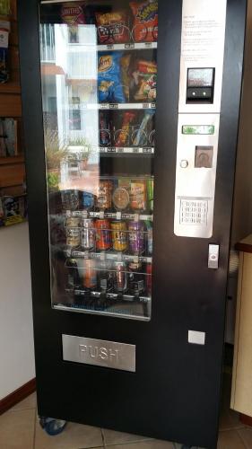 a vending machine filled with drinks and food at Dolphin Lodge Albany - Self Contained Apartments at Middleton Beach in Albany