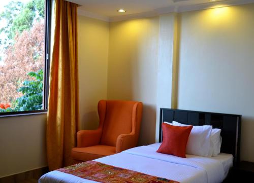 Postel nebo postele na pokoji v ubytování Gigiri Express Hotel