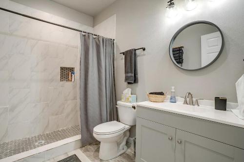 a bathroom with a toilet and a sink and a mirror at Unique Barn by the Lake in Bridgeport, Texas in Runaway Bay