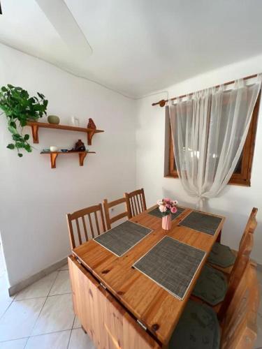 a dining room table and chairs in a room at Apartment Balatonfenyves in Balatonfenyves