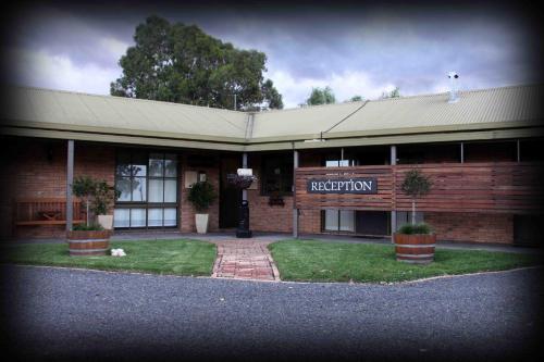a red brick building with a sign that reads recreation at Statesman Motor Inn in Corowa