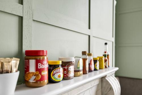a counter with a bunch of condiments on it at Imperial Plymouth in Plymouth
