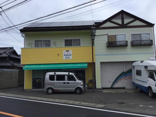 a van parked in front of a building at Guest House Ihatov - Vacation STAY 22102v in Takamatsu